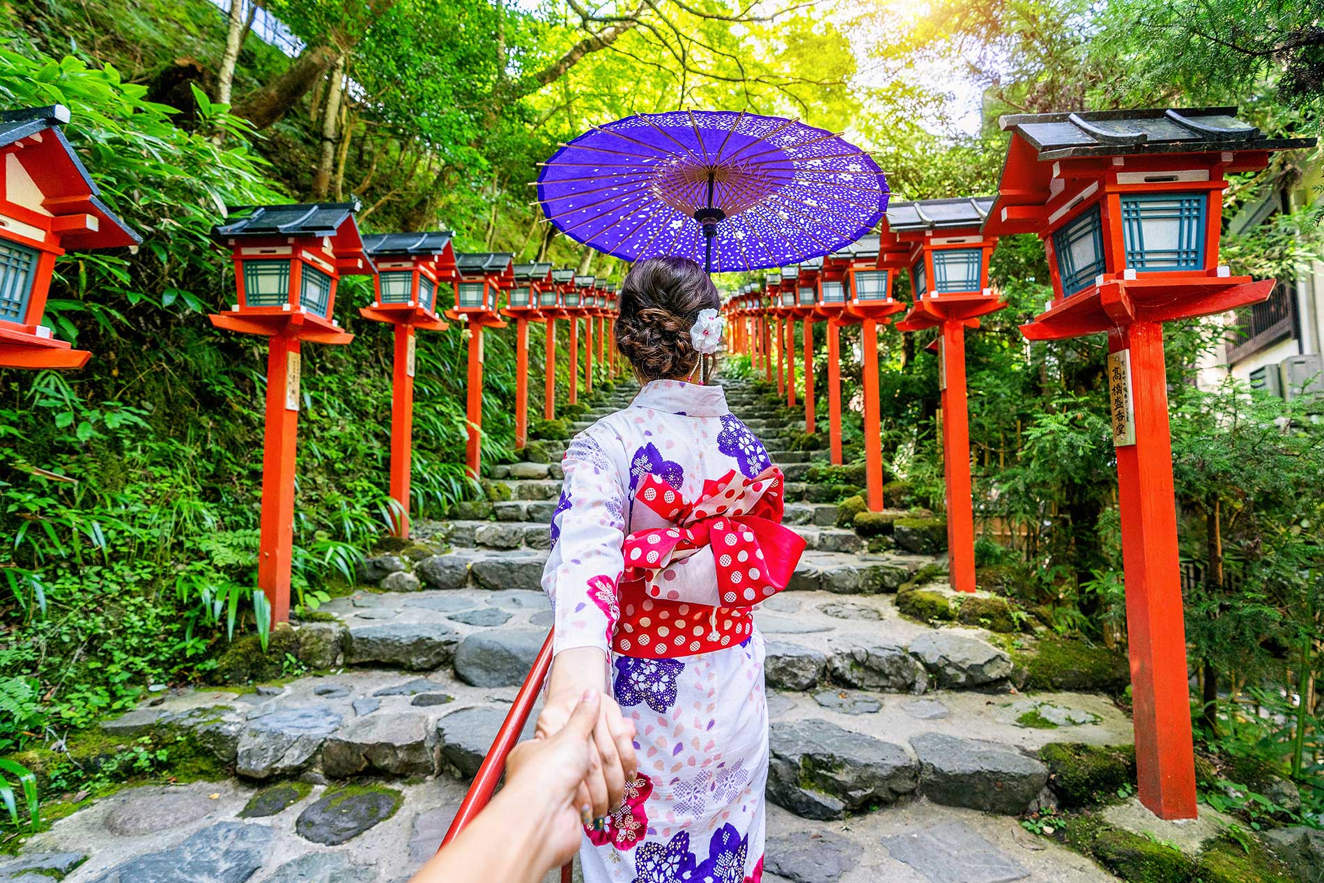 Kyoto, Japan — traditional shrine and cherry blossoms