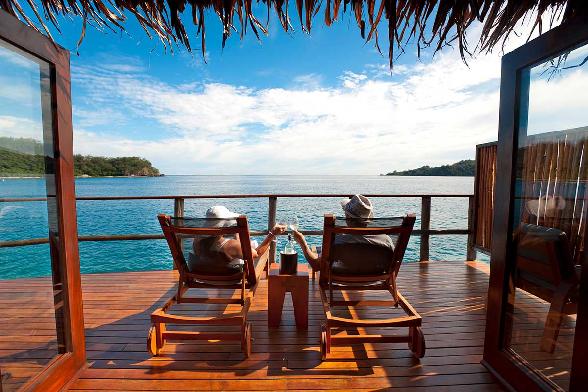 Why Australians love the South Pacific — overwater bungalows on a turquoise lagoon